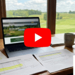 A realistic, high-quality featured image for a video series. Show an office desk with a laptop displaying a blurred golf course website and a visible YouTube-style play button overlay on the laptop screen.